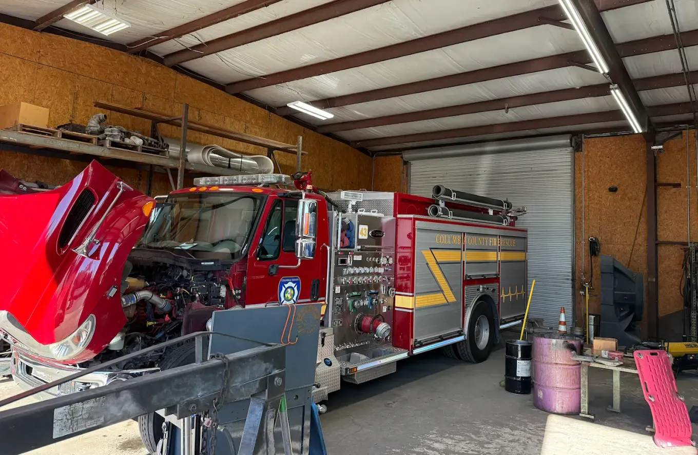 Fire truck with the cab tilted forward for engine repair at Southern Specialized in Lake City, FL